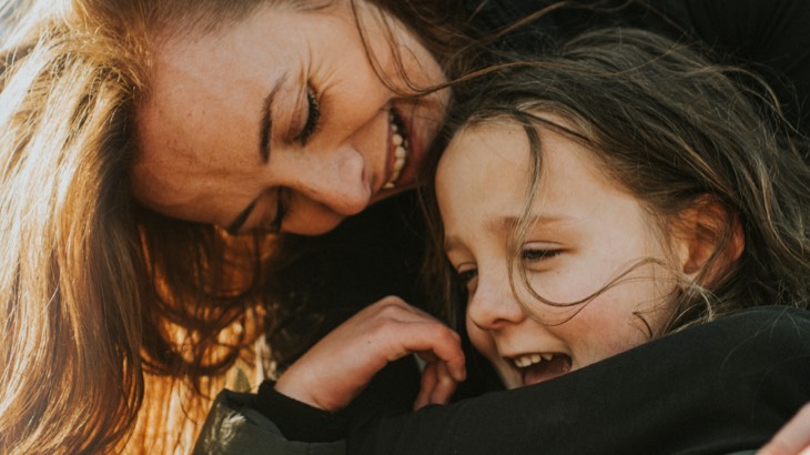 Woman hugging child