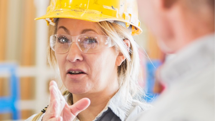 Woman in construction helmet