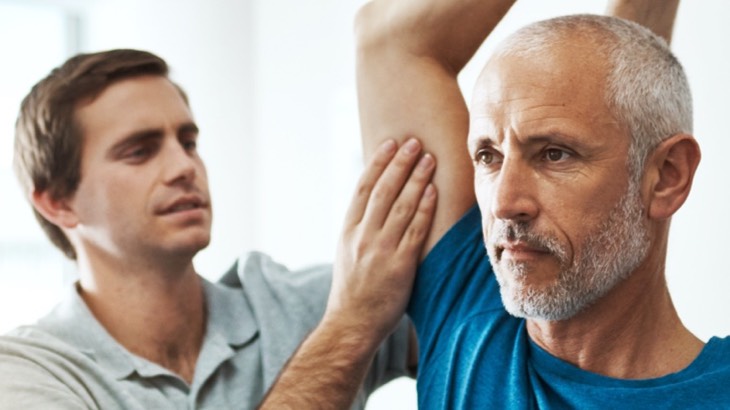Older man receiving physio treatment