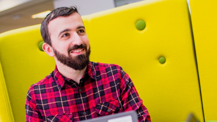 Smiling man in relaxed workplace
