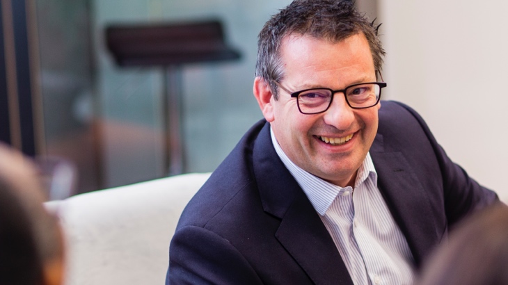 Smiling man in work meeting