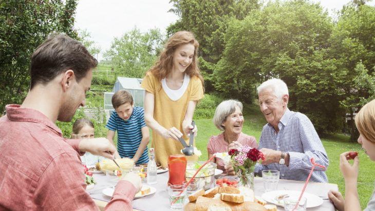 Senior parents and family in the garden toegther