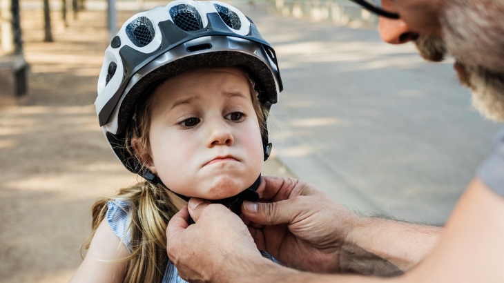 Child wearing a bicycle helmet